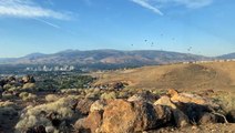 Hot air balloons soar through the sky on a gorgeous Reno day