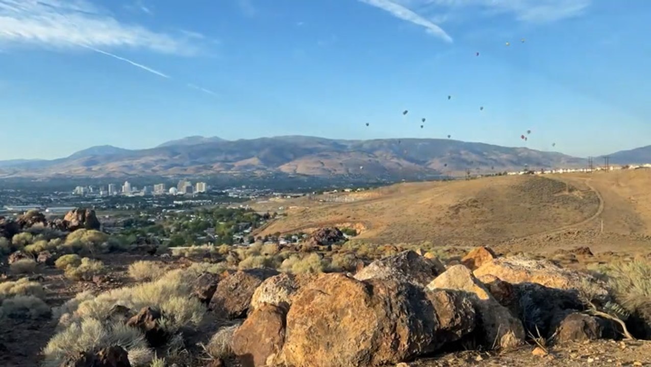 Hot air balloons soar through the sky on a gorgeous Reno day