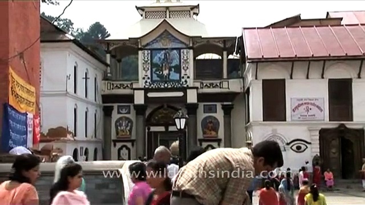 Nepali devotees wash their hands before prayer