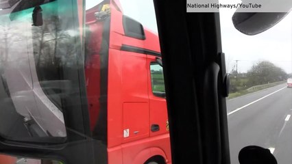 Footage shows lorry driver with a mobile phone to each ear on M4