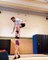 Circus Performer Jumps And Stands on Girlfriend’s Shoulders