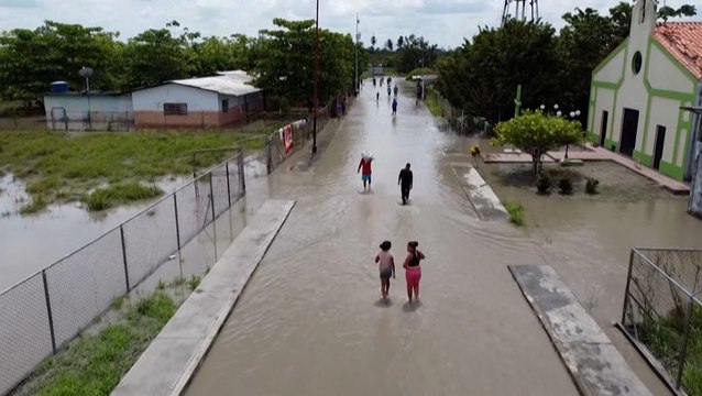 Venezuelan villagers try to salvage their livelihoods after severe floods