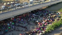 Thousands of migrants camp under Rio Grande bridge in Texas