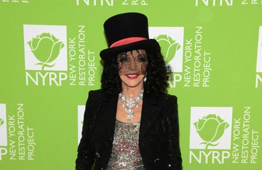 Dame Joan Collins gets COVID-19 booster shot