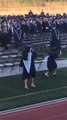 Teen Wearing High Heels Falls While Walking During Graduation Ceremony
