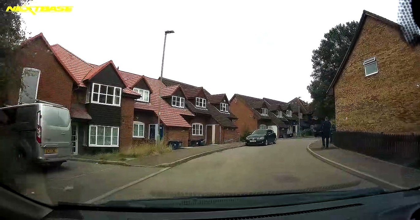Scootering Kid Shoots Out In Front Of Car