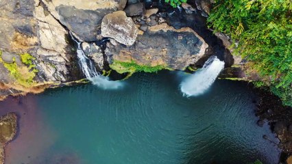 A Waterfalls Cascading From A Mountain Cliff