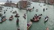 'Venice, Italy: Quartet of musicians perform on a violin-shaped boat'