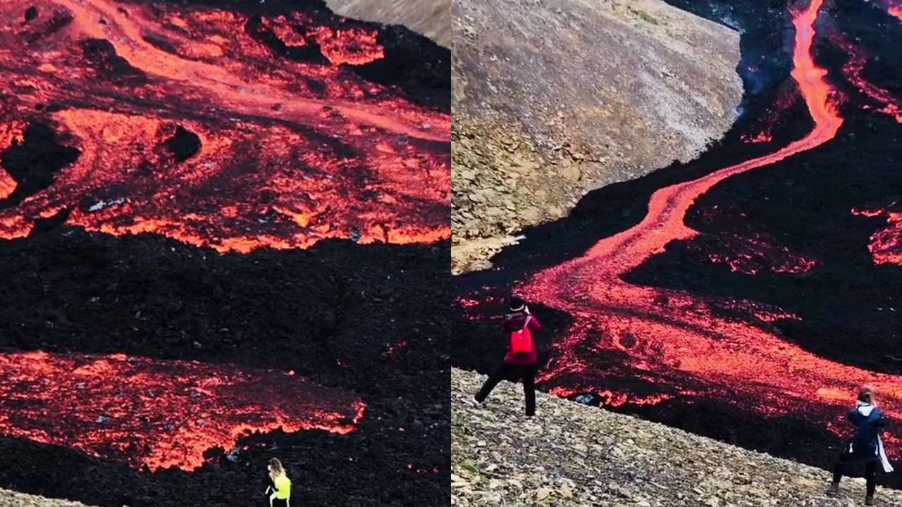'Tourists in awe of magnificent lava flowing from Fagradalsfjall Volcano'