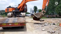 Excavator unloading from trailer/tata hitachi/ashok leyland 4019/semi low bed trailer