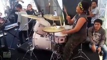 little boy playing drums