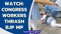 UP: BJP Pratapgarh MP Sangam Lal Gupta gets thrashed allegedly by Congress workers  | Oneindia News