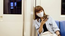 FREE COPYRIGHT FOOTAGE AUDIO VIDEO, Asian woman use smartphone in train