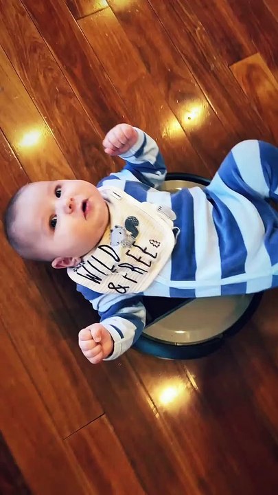 Baby Laying on a Roomba