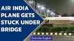 Air India plane gets stuck under foot over bridge in Delhi | Oneindia News