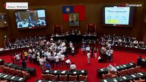 Taiwanese lawmakers brawl during a political speech