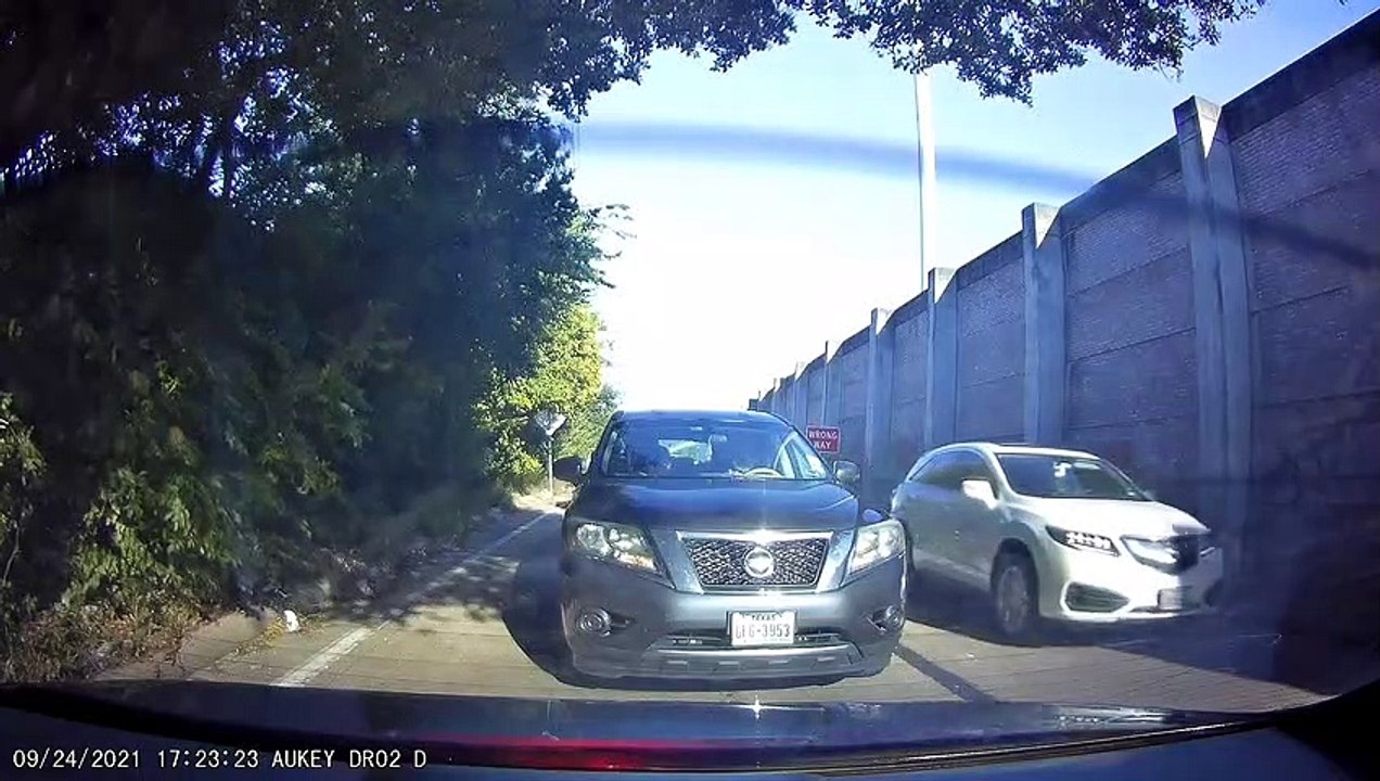 Upside-Down Car Slides Down Roadway