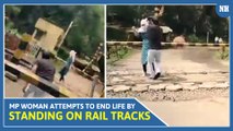 MP Woman Attempts to End Life by Standing on Rail Tracks, Brave Auto Driver Saves Her | Watch