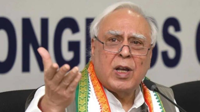 Congress workers protested outside Kapil Sibal's house