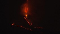 Lava explodes into the night sky from a new vent in the Cumbre Vieja volcano