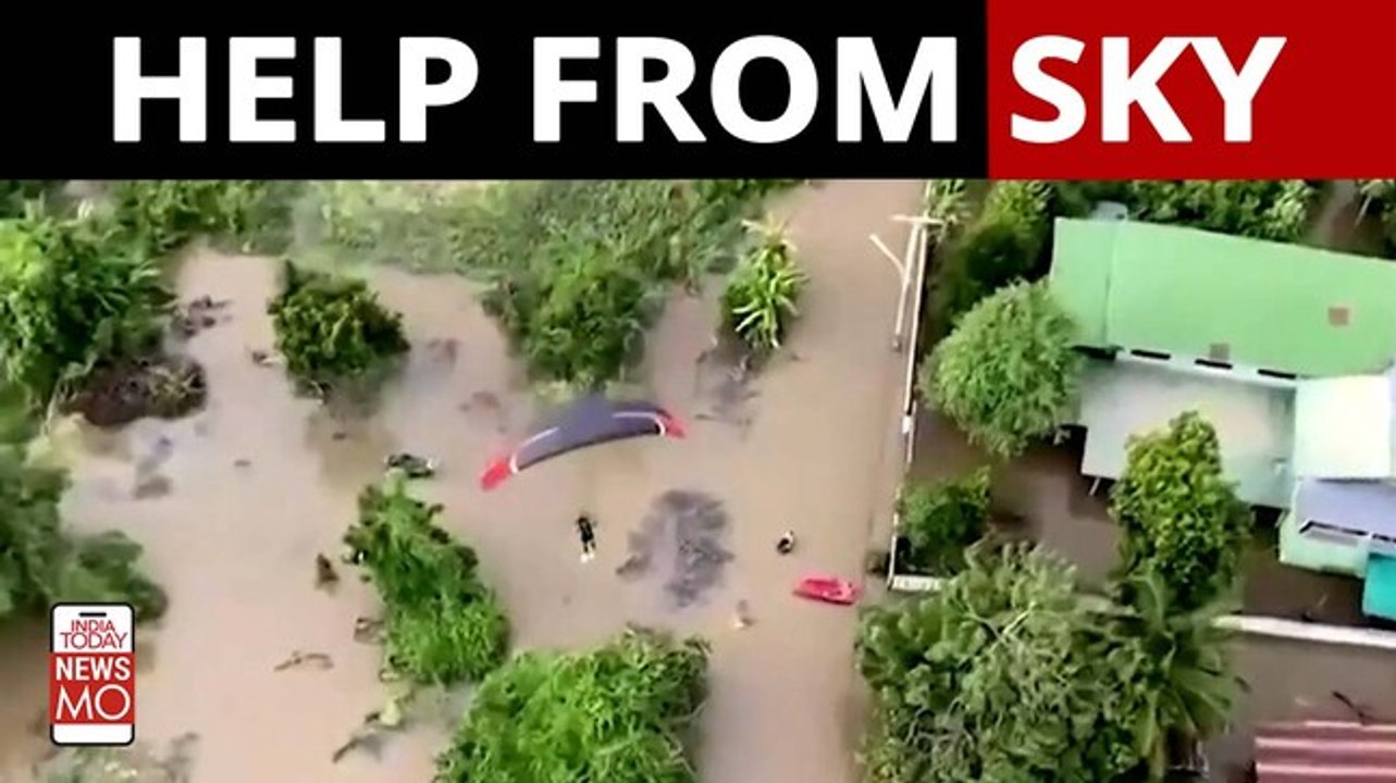 Paragliders bring relief to flood victims during Thailand's destructive monsoon season