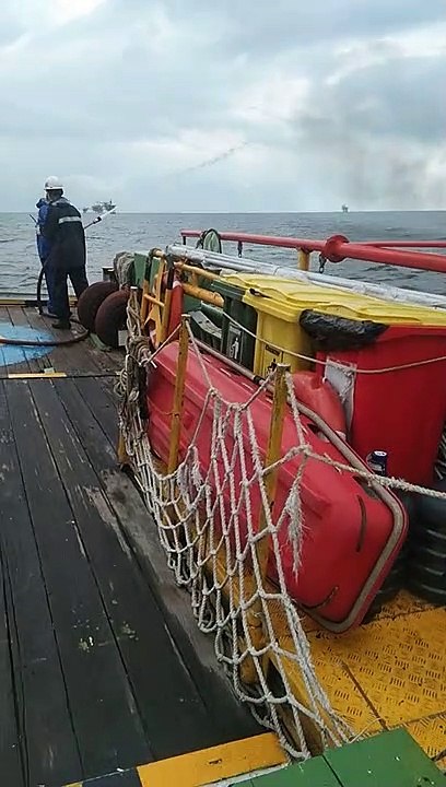 Asist other man in fire at sea