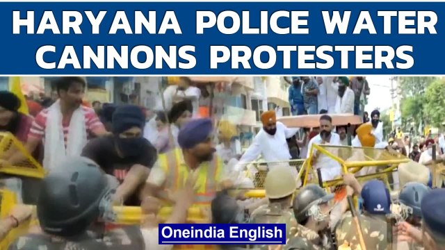 Haryana Police use water cannon on farmers protesting outside CM Khattar's house | Oneindia News