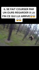 Un vététiste courser par un ours