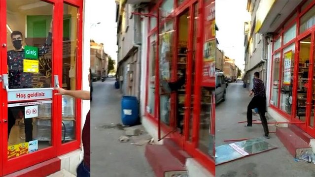 Markete kilitlenen hırsız camı kırarak kaçtı