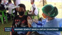 Pakai Perahu, Personel Marinir Jemput Warga Untuk Vaksinasi