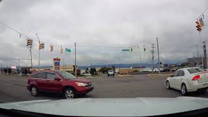 Car Runs Red Light in Front of Police