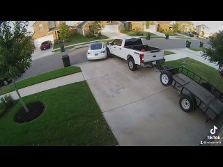 Roommate Moving Tesla Out of Garage Hits Truck