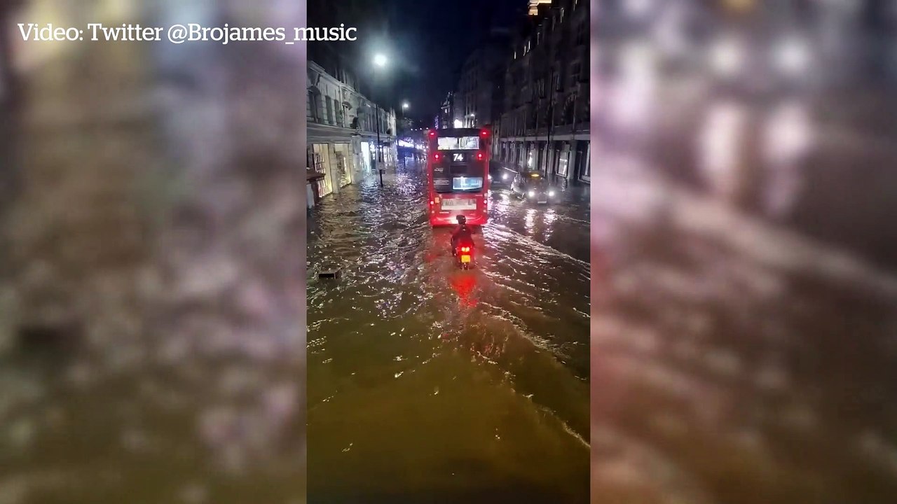 Streets of West London flooded with water after torrential rain - video ...