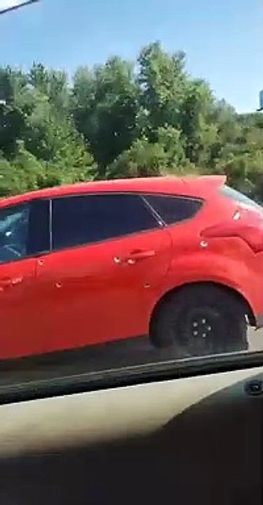 Car Riddled With Bullet Holes