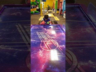 Kid Doesn't Quite Understand Air Hockey