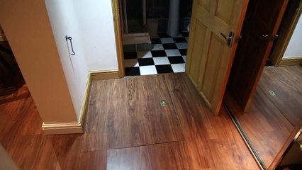 Il découvre une trappe dans son appartement, ce qu'elle renferme est hallucinant