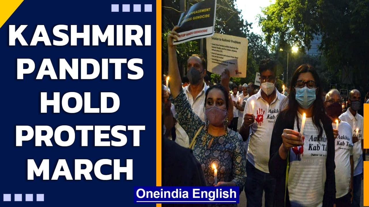 Kashmiri pandits hold candlelight march to prot...
