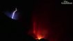 Lightning flashes over La Palma volcano as lava engulfs buildings