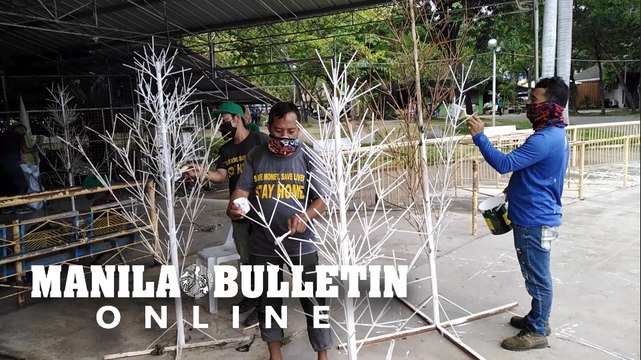 Davao City personnel refurbish steel Christmas trees for the Pasko Fiesta celebrations
