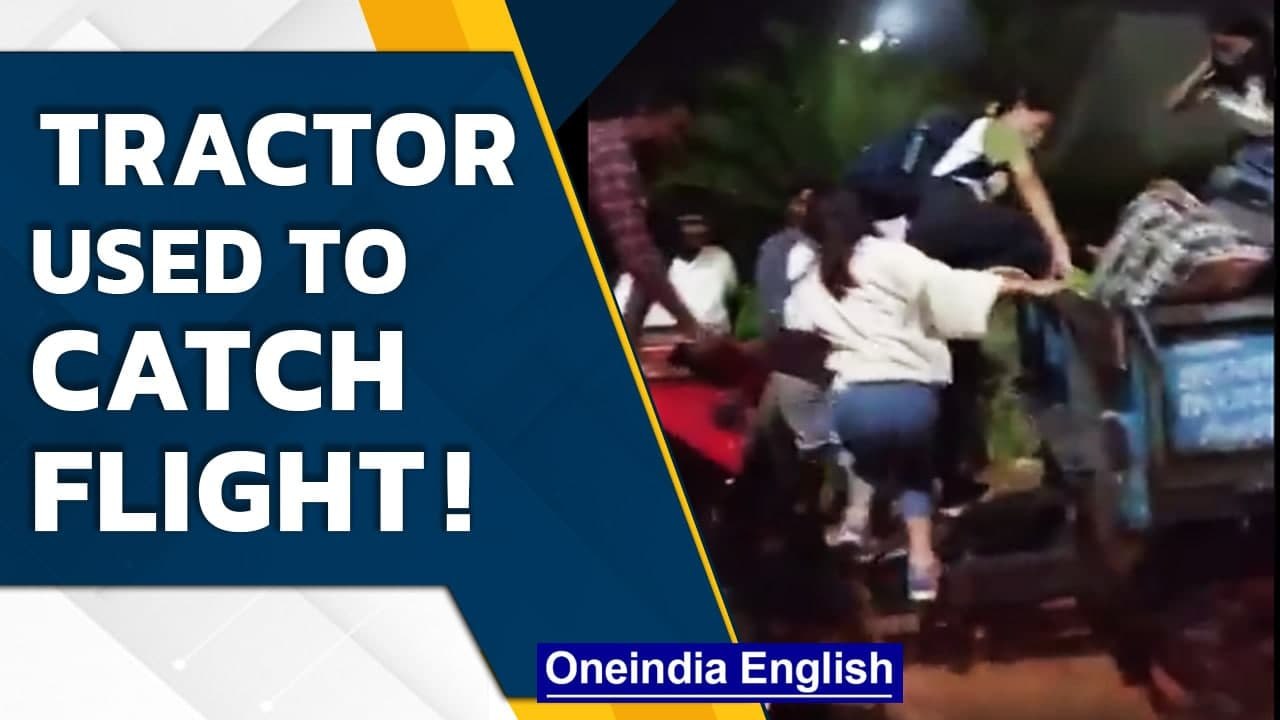 Bengaluru passengers use tractor to catch flight, airport severely waterlogged | Oneindia News