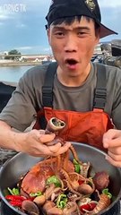 Chinese fisherman eating Seafood vigorously