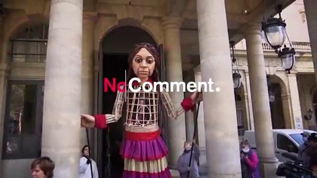 Giant puppet, of Syrian girl, visits sights of Paris