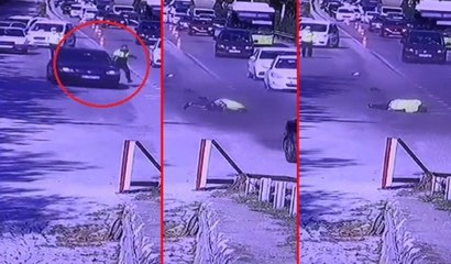 Trafik polisi kaçmak isteyen otomobilin kapısında böyle sürüklendi