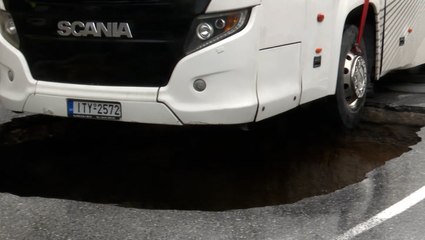 Bus falls into sinkhole amid Storm Ballos