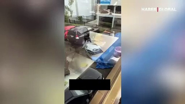 Arabasını doludan korumak için bedenini kullandı