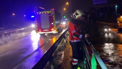 Firefighters Rescue Man Trapped in Car During Flood