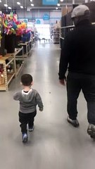 Little Boy Practices Walking Like Dad