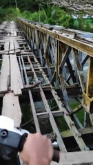 Scooter Crosses Sketchy Bridge