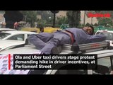 Ola and Uber taxi drivers stage protest demanding hike in driver incentives, at Parliament street