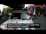 Artists participate in a rally celebrating 'World Art Day' in Kolkata
